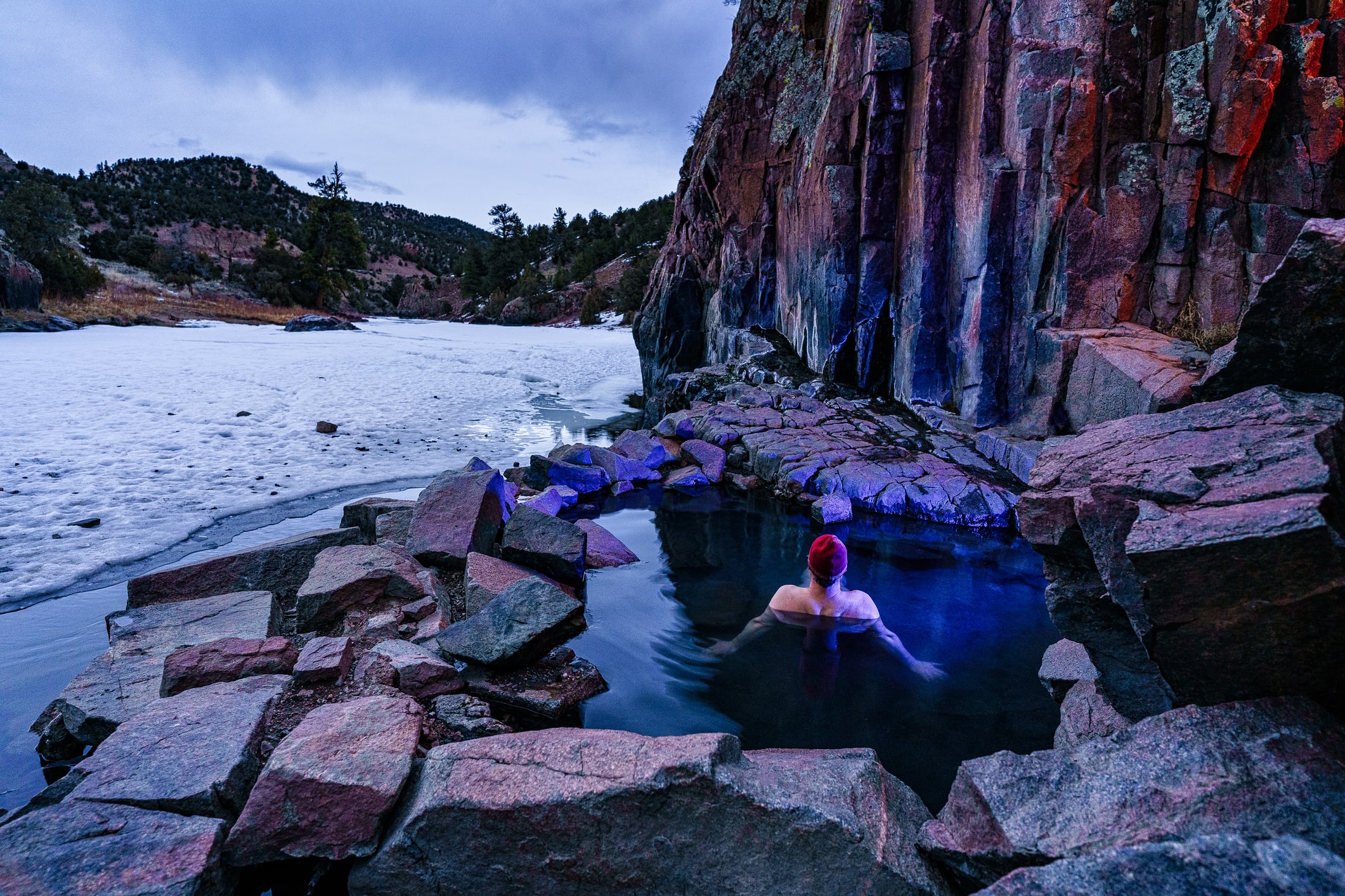 Man Soaking in Outdoor Hot Springs